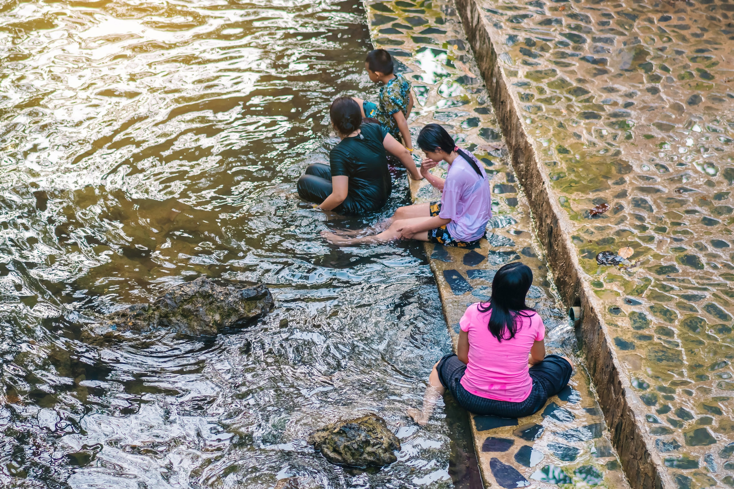 people resting in water