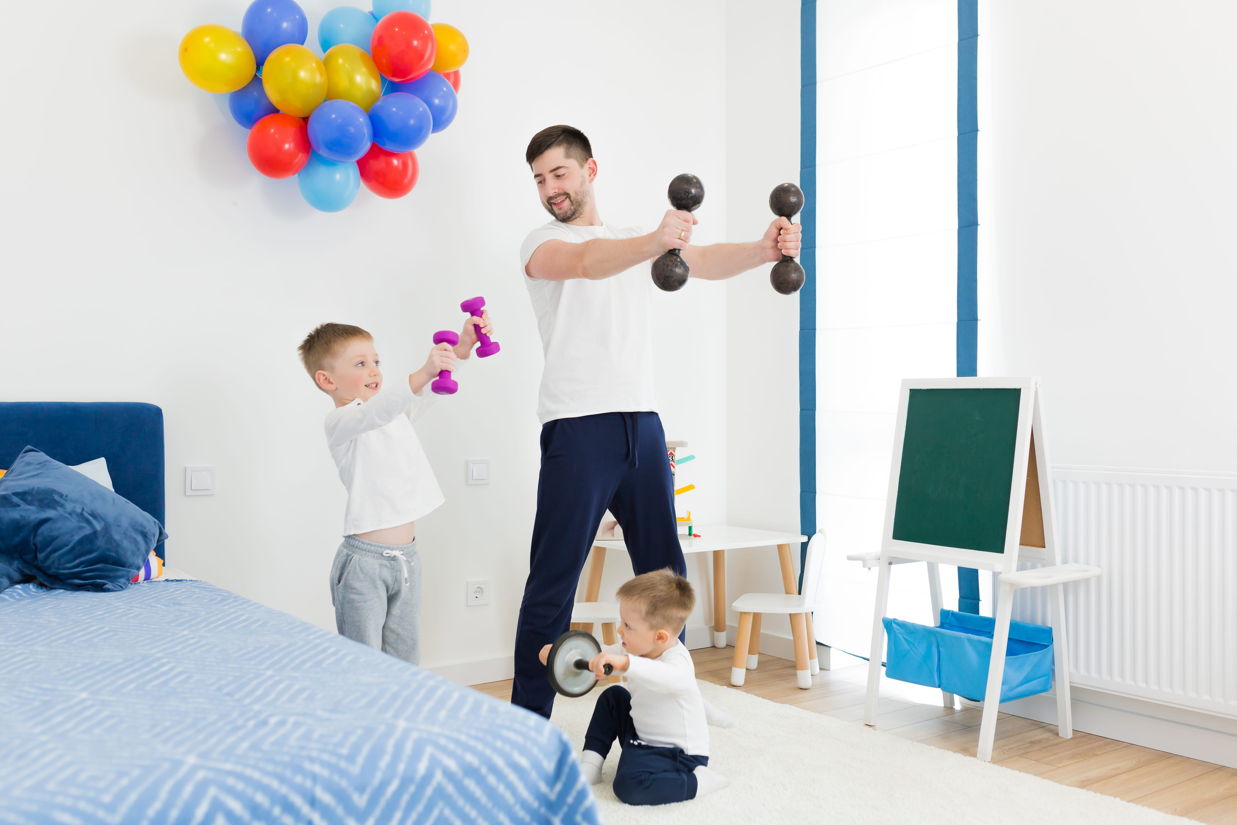 father working out with chidren