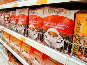 SEREMBAN, MALAYSIA -JUNE 8, 2020: Selected focused of 3 in 1 drinks packed in the soft pack and displayed for sale inside the supermarket. Sorted by the brand for easy for the customer to choose from