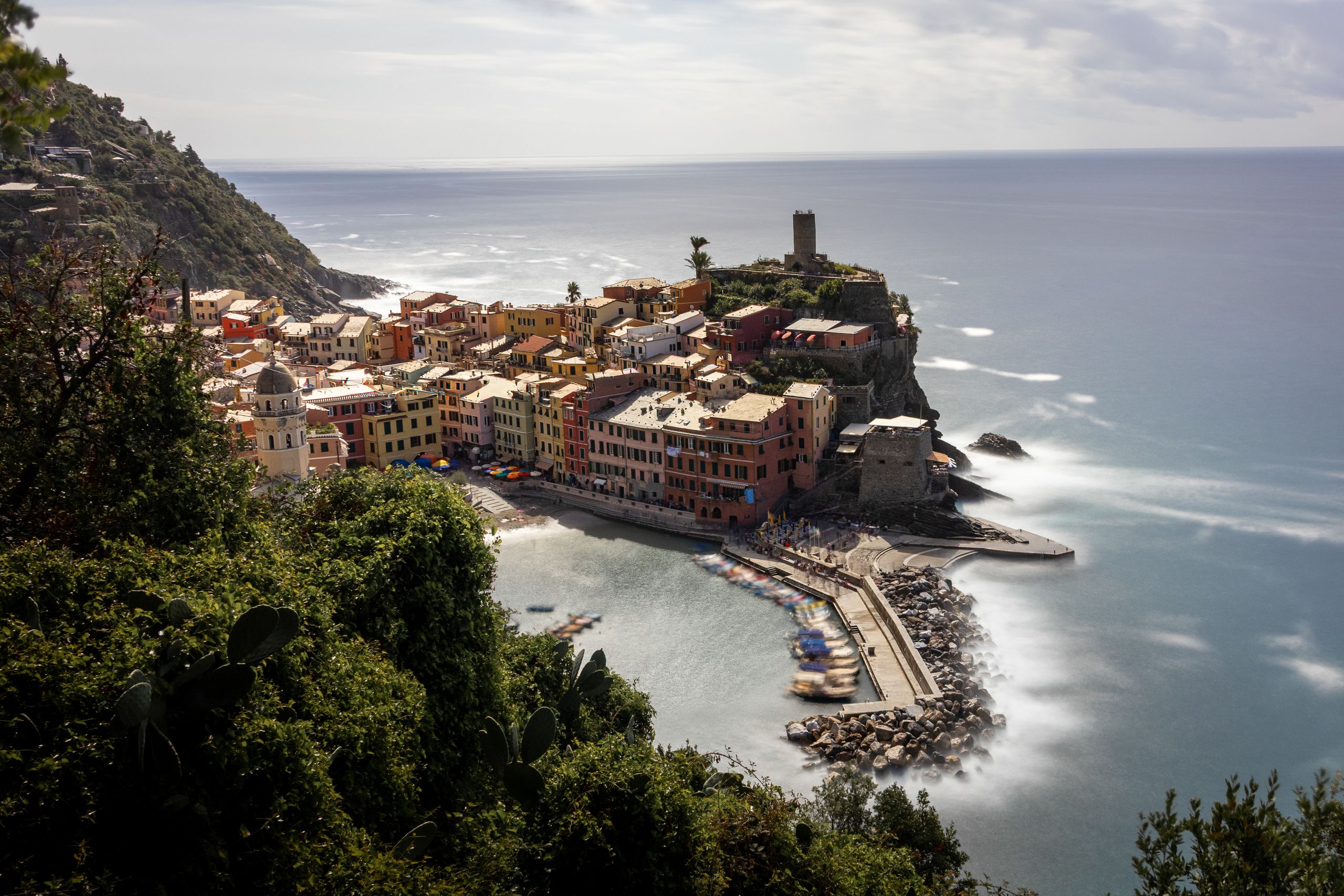 Picturesque Vernazza coastline in Cinque Terre with colorful buildings and sea view.